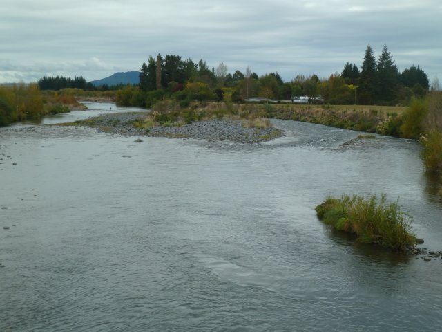 The rip rap on the right has a damaged section that needs repair. The river will be pushed from the channel on the right to the channel on the left.